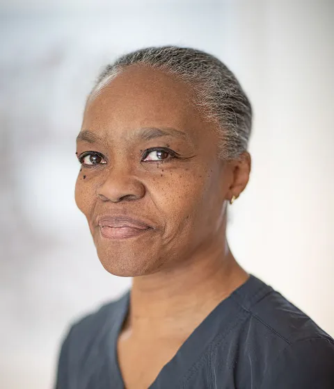 Dr Andrina Louisy